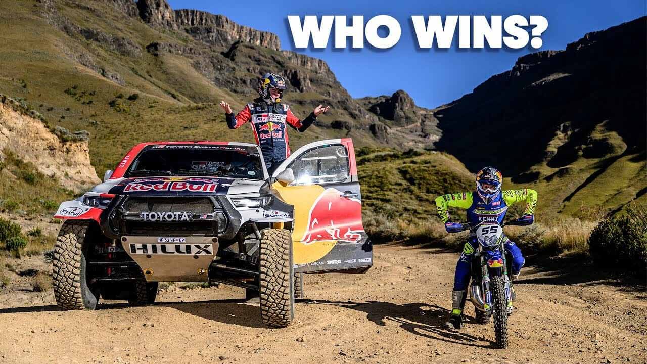 Racing Toyota Hilux and enduro motorcycle Sherco compared in a race up the mountain