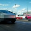 Tesla Cybertruck pickup with a Porsche on a trailer raced against a Porsche 911